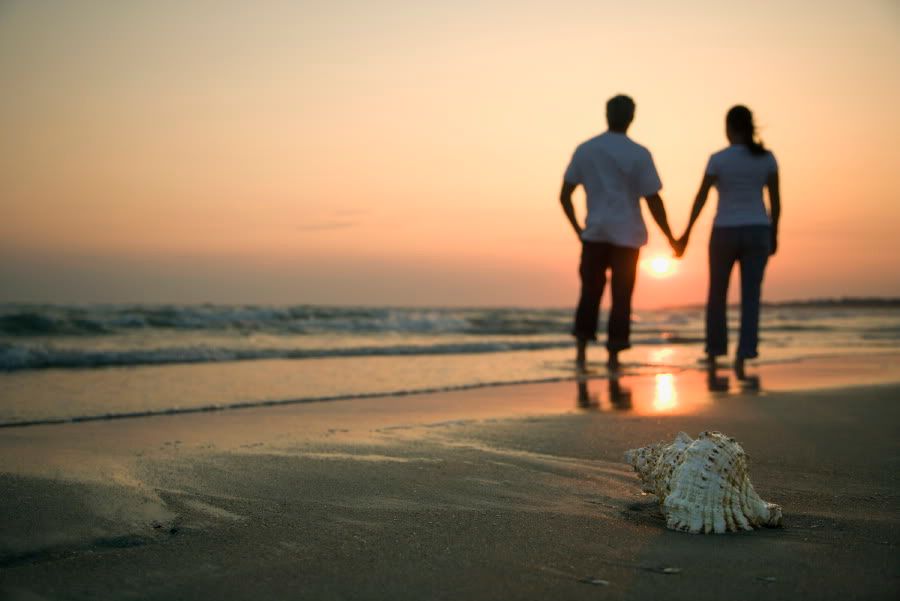 couple holding hands on beach. Couple Holding Hands On Beach